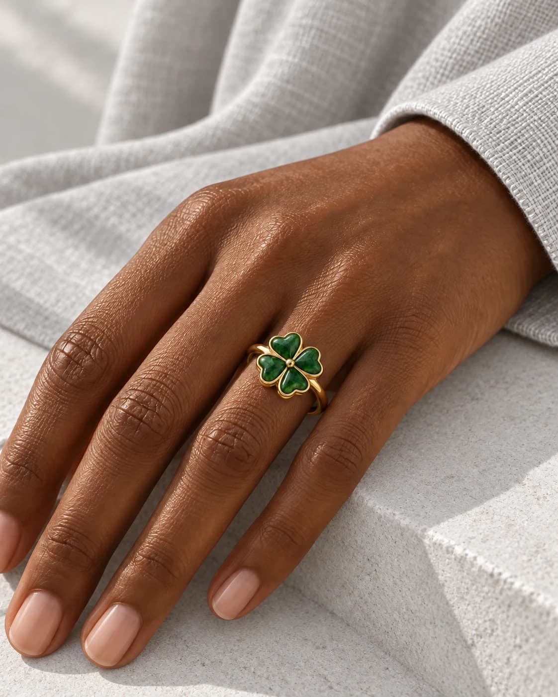 Green clover ring worn on a hand — AI styling preview